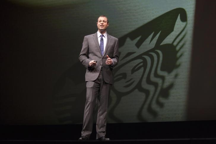 Adam Brotman, is pictured on stage during the company's annual shareholders meeting in Seattle