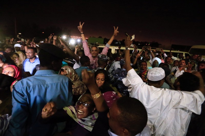 Supporters shout outside the National Prison during the release of politicians and journalists, after demonstrations in Khartoum