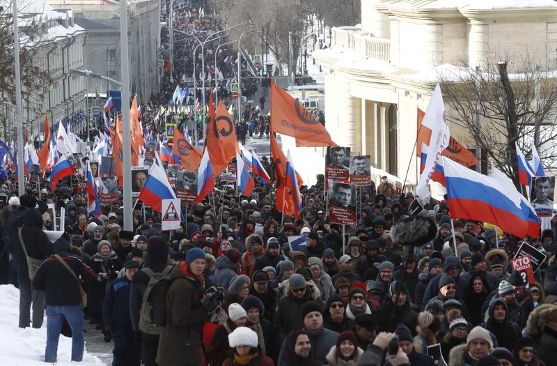 People attend a rally marking the third anniversary of Russian opposition politician Nemtsov's death in Moscow