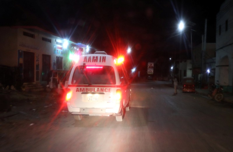 Aamin ambulance drives from the scene of an explosion near the Presidential palace in Mogadishu