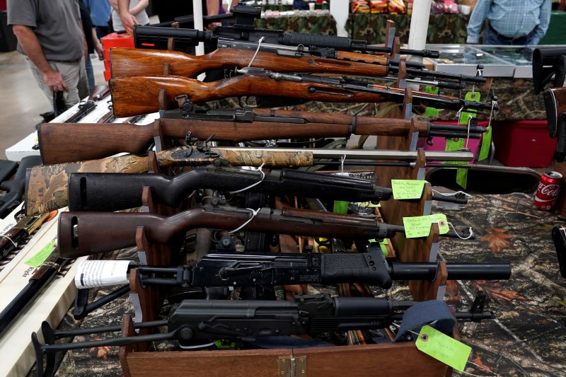 FILE PHOTO - Rifles are displayed for sale at the Guntoberfest gun show in Oaks, Pennsylvania