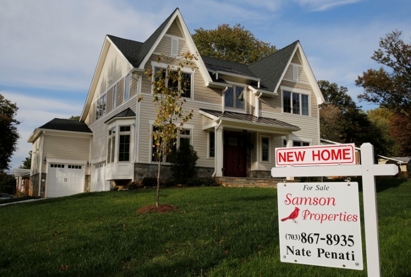 FILE PHOTO: A real estate sign advertising a new home for sale is pictured in Vienna, Virginia