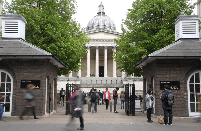 Students and visitors are seen walking around the main campus buildings of University College London (UCL) in London, Britain