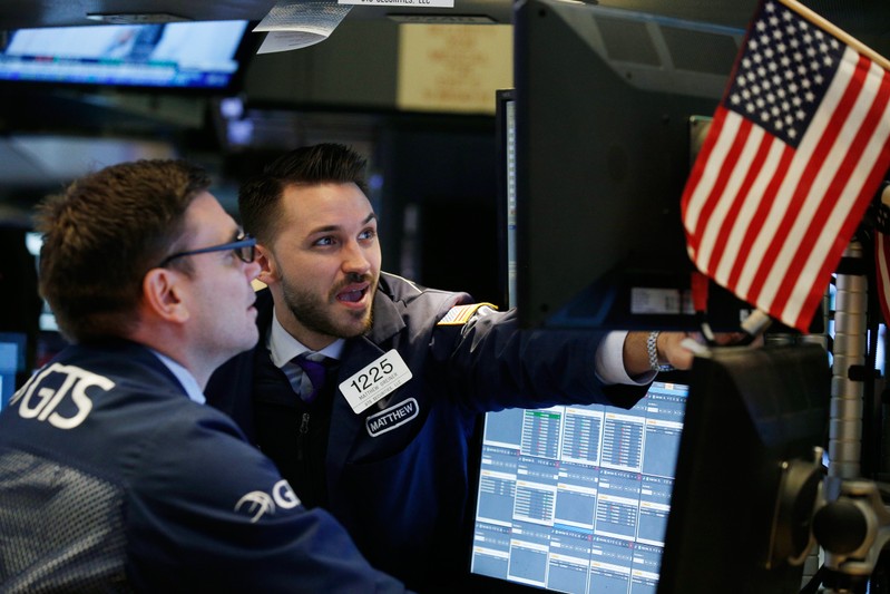 Traders work on the floor of the New York Stock Exchange ahead of the opening bell in New York