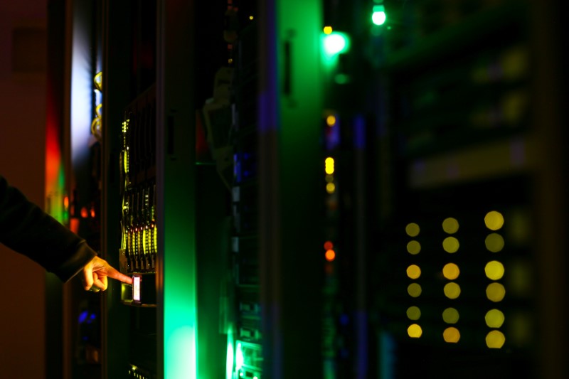 Illustration picture of man posing inside a server room at an IT company