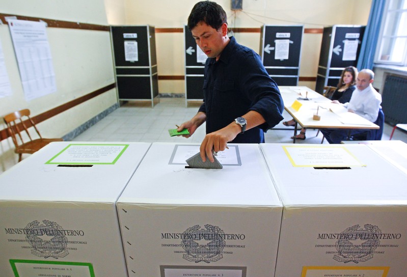 FILE PHOTO: A man casts his ballot at a polling station in downtown Rome