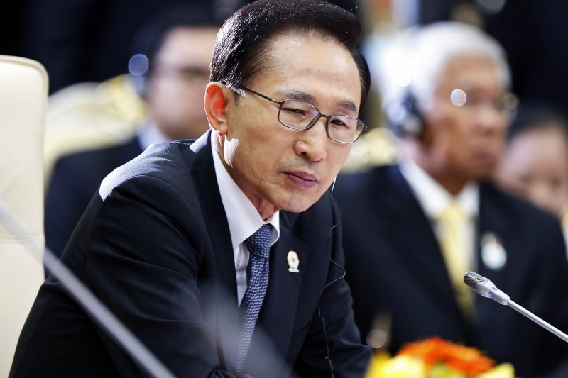 FILE PHOTO: Former South Korean President Lee attends the 21st ASEAN and East Asia summits in Phnom Penh