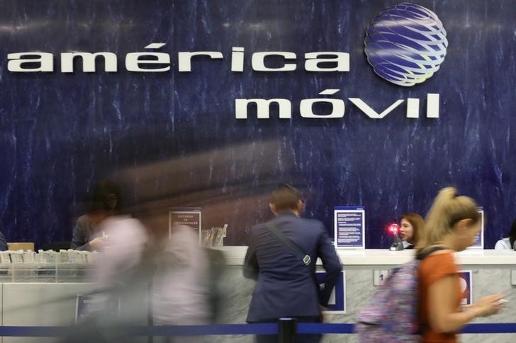 The logo of America Movil is pictured on the wall of a reception area in the company's corporate offices in Mexico City