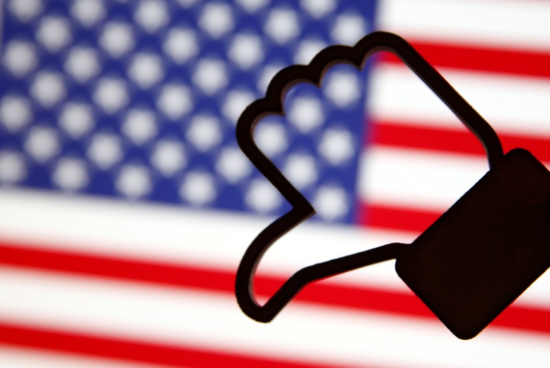 FILE PHOTO: A 3D-printed Facebook Like symbol is displayed inverted in front of a U.S. flag in this illustration