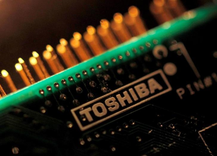 FILE PHOTO: A logo of Toshiba Corp is seen on a printed circuit board in this photo illustration taken in Tokyo