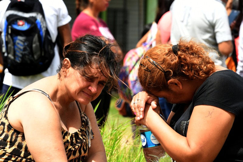 Relatives of inmates of Palmasola prison react after violence inside the prison in Santa Cruz
