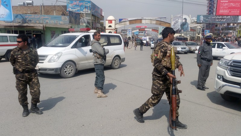 Afghan security forces keep watch near the site of a blast in Kabul