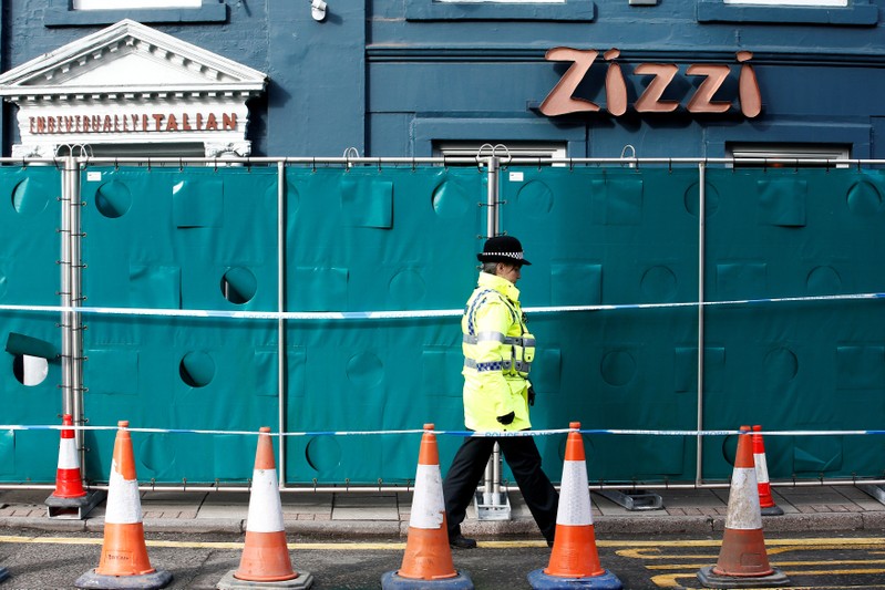 A police officer stands on duty outside a restaurant which has been secured as part of the investigation into the poisoning of former Russian inteligence agent Sergei Skripal and his daughter Yulia, in Salisbury