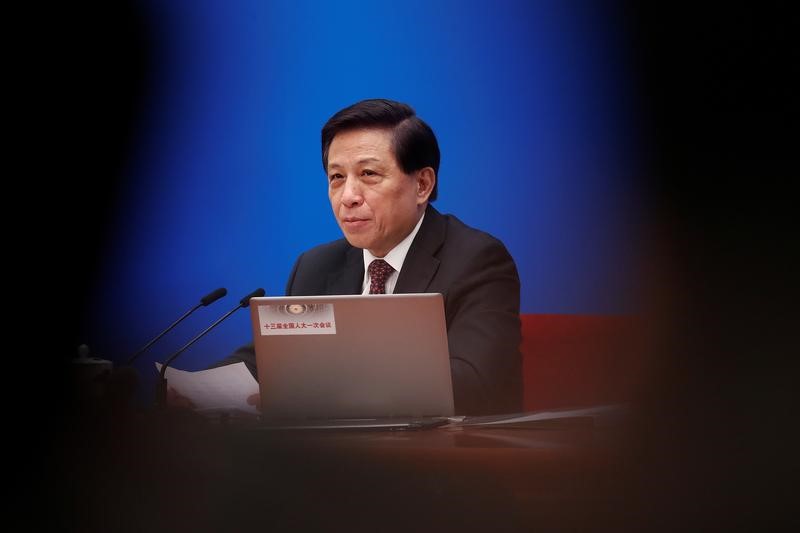Zhang Yesui, a spokesman for National People's Congress (NPC), addresses reporters ahead of China's annual session of parliament at the Great Hall of the People in Beijing
