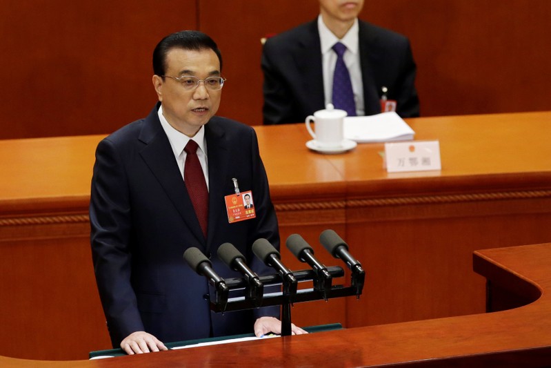 Chinese Premier Li Keqiang speaks at the opening session of the National People's Congress (NPC) at the Great Hall of the People in Beijing