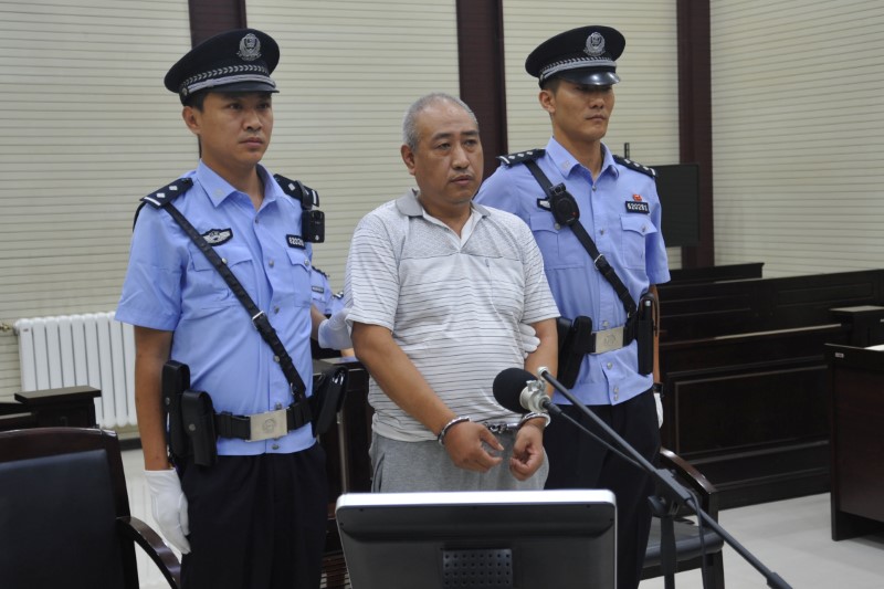 Gao Chengyong attends a trial at the Intermediate People's Court in Baiyin