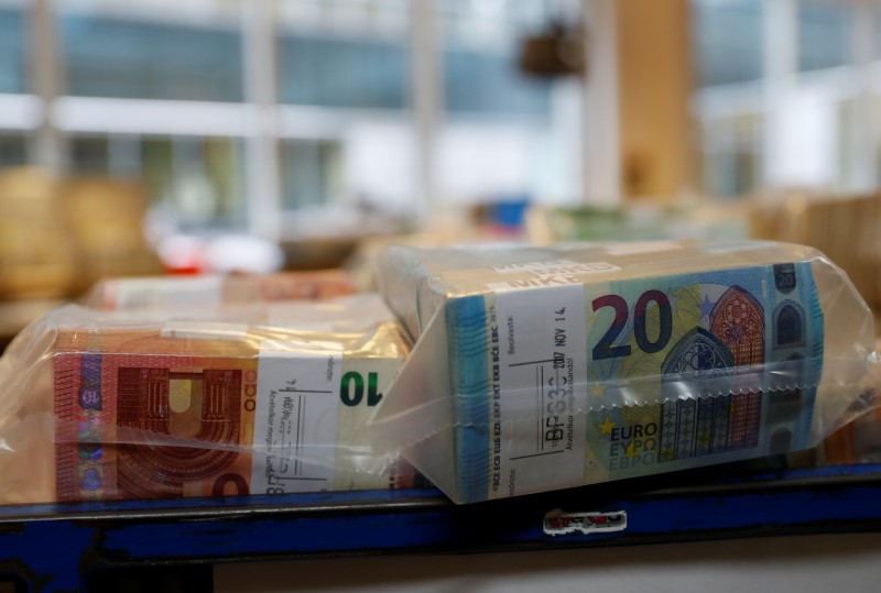 FILE PHOTO: Packed 10 and 20 Euro banknotes are seen at the Money Service Austria company's headquarters in Vienna