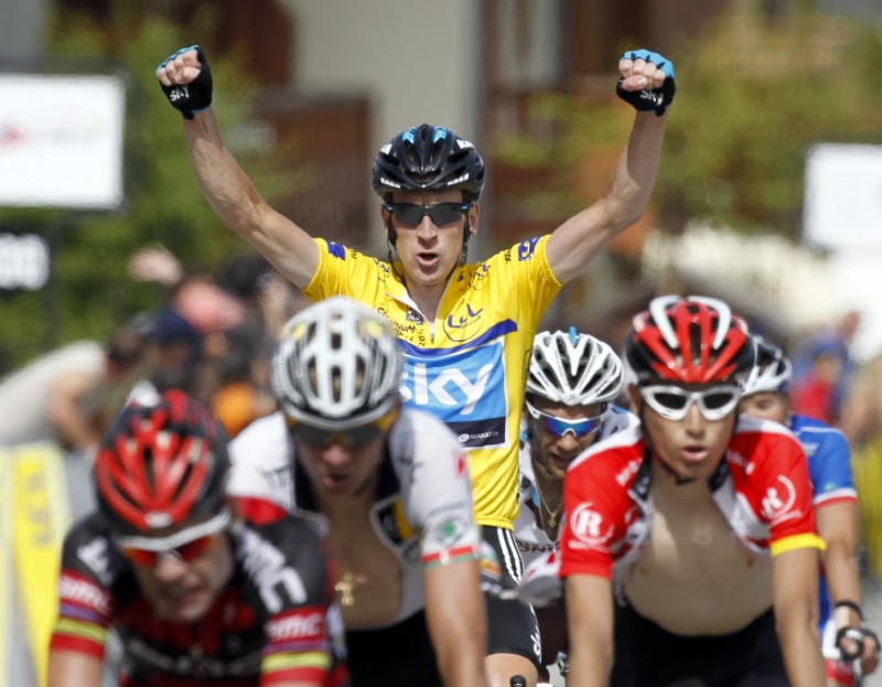 Yellow jersey Sky team's Wiggins (top) of Britain wins the race after the last stage of the Dauphine cycling race between Pontcharra and La Toussuire