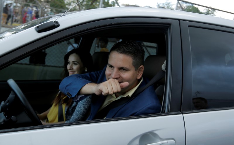 Fabricio Alvarado, presidential candidate of the National Restoration party (PRN), reacts in a car during his visit to a neighbourhood in San Jose, Costa Rica