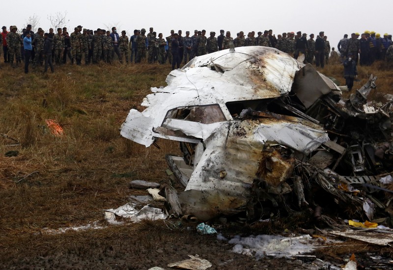 A cockpit of a crashed US-Bangla airplane lies on the crash site at the Tribhuvan International Airport in Kathmandu