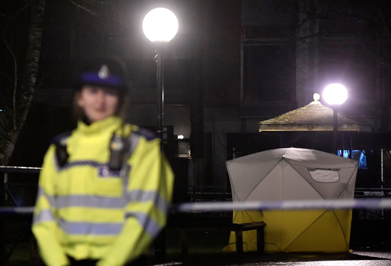 Police officers stand guard beside a cordoned-off area, after former Russian military intelligence officer Sergei Skripal, who was convicted in 2006 of spying for Britain, became critically ill after exposure to an unidentified substance, in Salisbury, sou