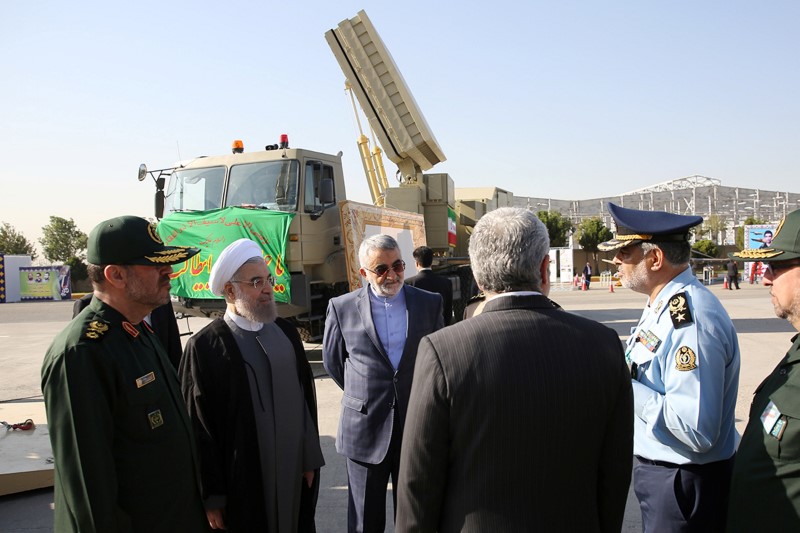 File photo of Iran's President Hassan Rouhani and Iranian Defence Minister Hossein Dehghan standing near the new air defense missile system Bavar-373, in Tehran