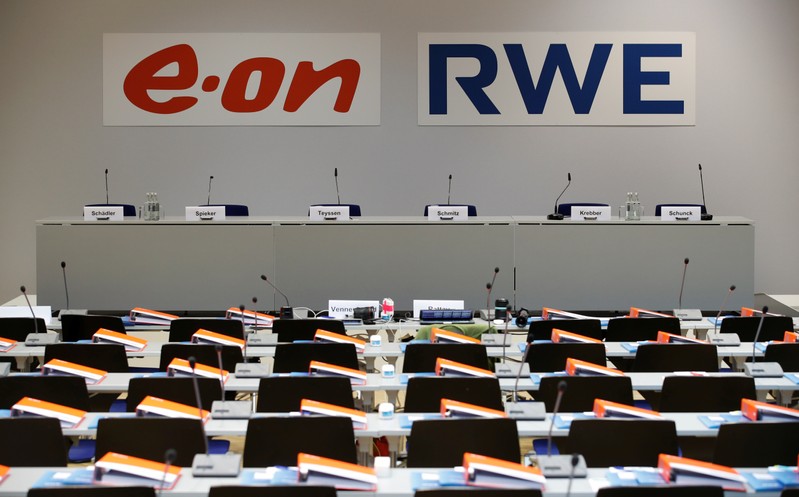 The logos of RWE and E.ON are seen before a joint news conference of the two German utilities after unveiling plans for an asset swap deal which will break up RWE's Innogy unit in Essen