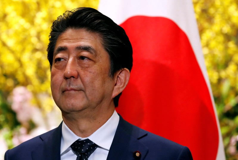 Japan's Prime Minister Shinzo Abe waits for Sri Lanka's President Maithripala Sirisena in Tokyo