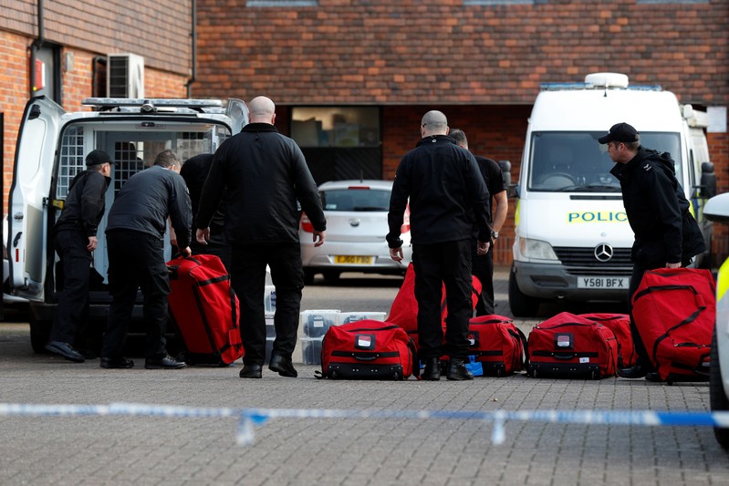 Police officers prepare equipment as inspectors from the Organisation for the Prohibition of Chemical Weapons begin work at the scene of the nerve agent attack on former Russian agent Sergei Skripal, in Salisbury