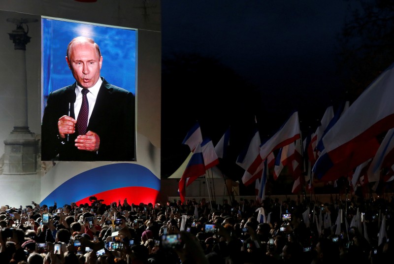 FILE PHOTO: Russian President Vladimir Putin addresses the audience during a rally in Sevastopol