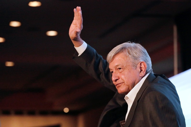 Leftist front-runner Andres Manuel Lopez Obrador of the MORENA waves to the audience after a conference in Guadalajara