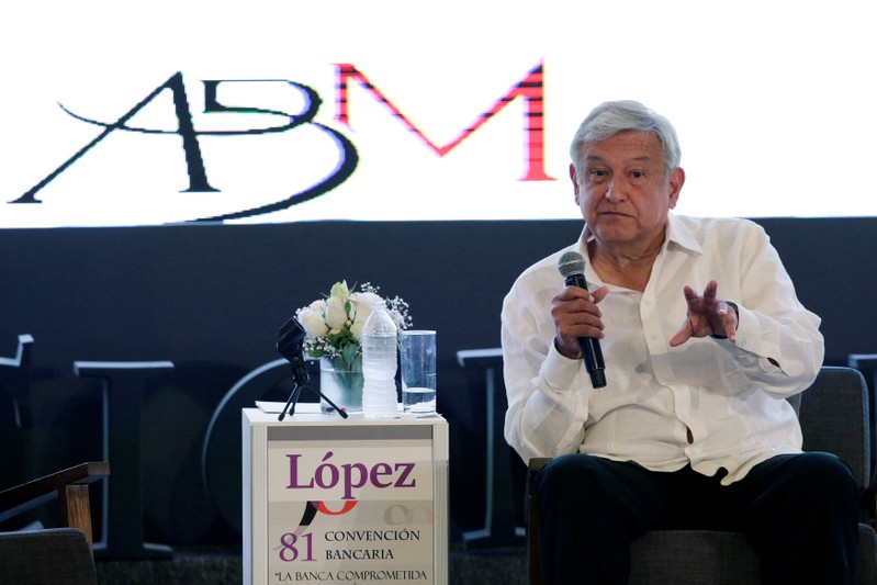 Leftist front-runner Lopez Obrador, presidential candidate for of the National Regeneration Movement, gestures during the Mexican Banking Association's annual convention in Acapulco