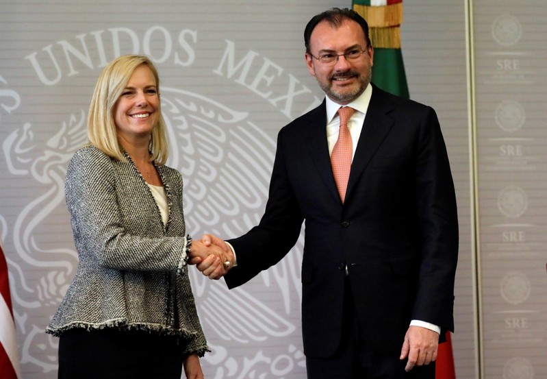 U.S. Homeland Security Secretary Kirstjen Nielsen shakes hands with Mexico's Foreign Minister Luis Videgaray after delivering a joint message in Mexico City