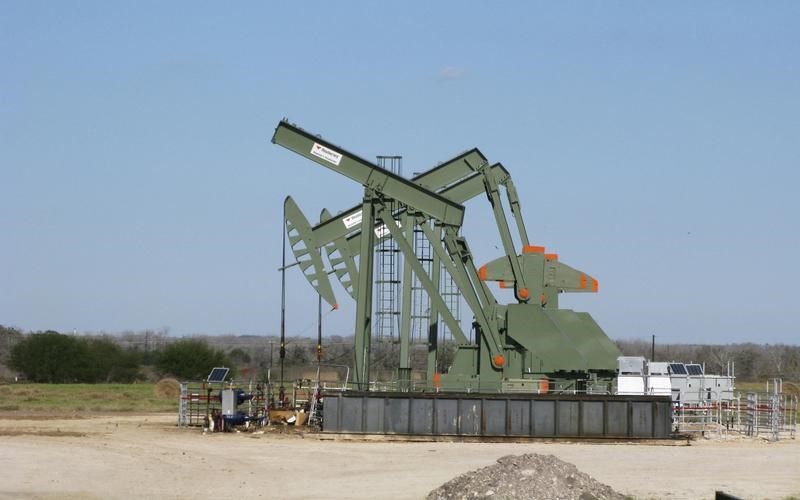 FILE PHOTO: A pump jack used to help lift crude oil from a well in South Texas’ Eagle Ford Shale formation stands idle in Dewitt County Texas