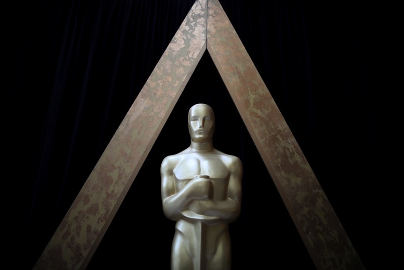 An Oscar statue is seen outside the Dolby Theatre during preparations for the Oscars in Hollywood, Los Angeles