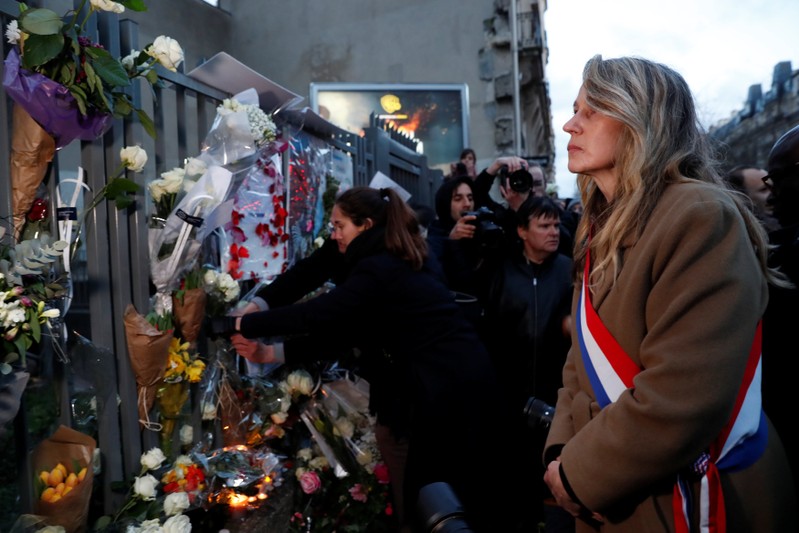 People attend a gathering organised by the CRIF Jewish organisation in memory of Mireille Knoll in Paris