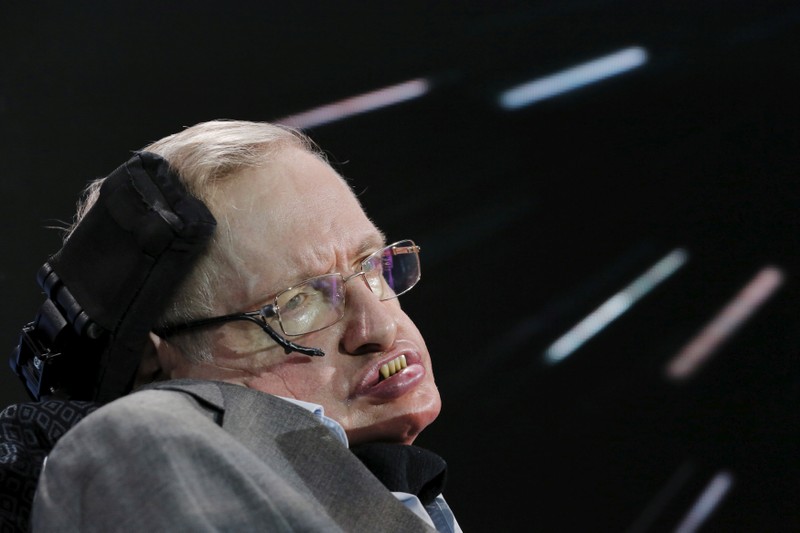FILE PHOTO: Physicist Stephen Hawking sits on stage during an announcement of the Breakthrough Starshot initiative with investor Yuri Milner in New York