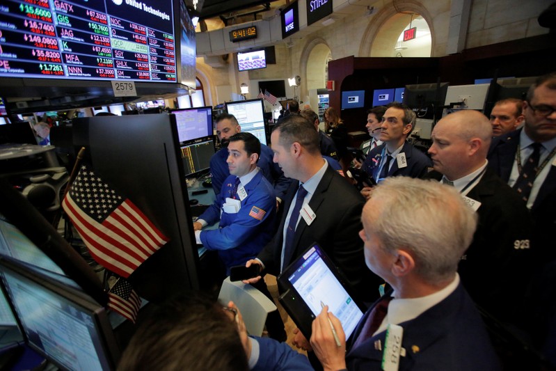 Traders work on the floor at the New York Stock Exchange (NYSE) in Manhattan, New York
