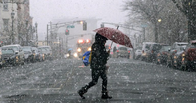 Storm moves up East Coast dumping snow, knocking out power