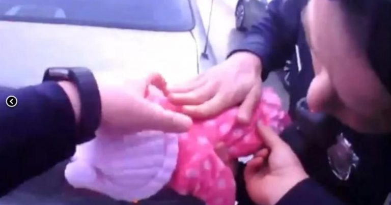 Video shows officers saving choking baby in middle of intersection