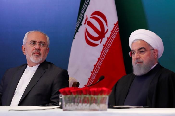 Iranian President Hassan Rouhani (R) and Foreign Minister Mohammad Javad Zarif attend a meeting with Muslim leaders and scholars in Hyderabad