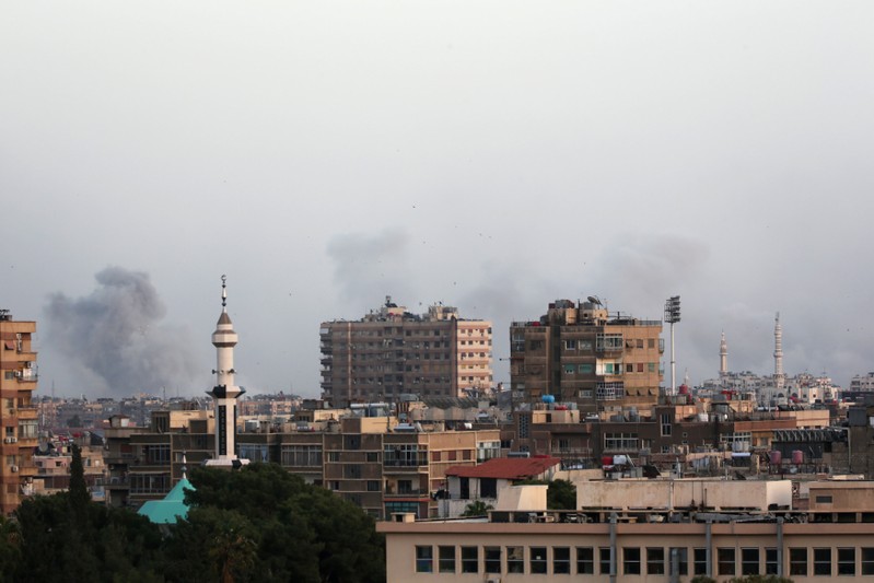 Smoke rises from Yarmouk Palestinian camp in Damascus