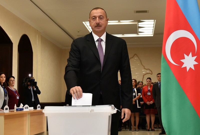 FILE PHOTO: Azerbaijan's President Aliyev casts his vote during referendum in Baku