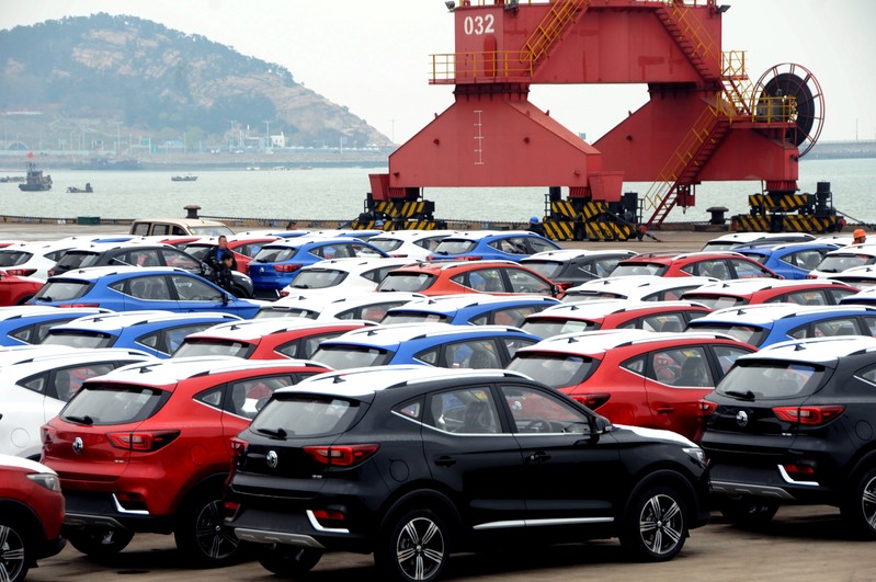 Cars waiting to be exported are seen at a port in Lianyungang