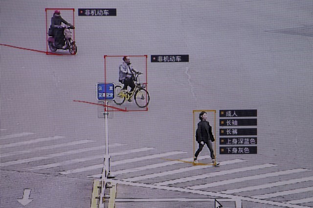 FILE PHOTO: SenseTime surveillance software identifying details about people and vehicles runs as a demonstration at the company's office in Beijing