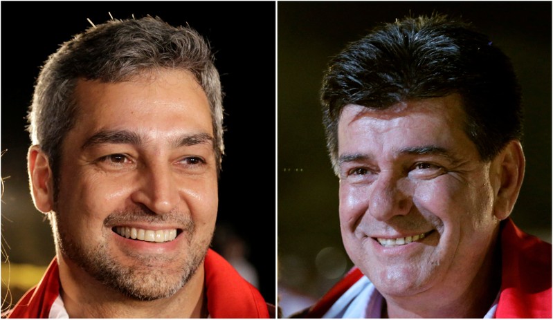 FILE PHOTO: Paraguayan presidential candidates Mario Abdo Benitez of Colorado Party (L) and Efrain Alegre of the GANAR coalition smile during campaign rallies on April 18, 2018 and April 19, 2018 respectively in this combination picture.