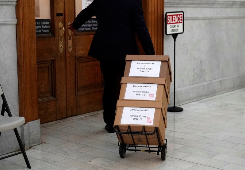 Boxes of evidence are brought to the court room for actor and comedian Bill Cosby's sexual assault retrial at the Montgomery County Courthouse in Norristown, Pennsylvania