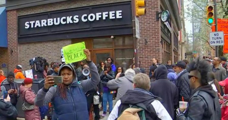 Demonstrators protest at Starbucks after controversial arrest of two black men