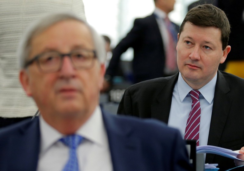 FILE PHOTO: General Secretary of the European Commission Selmayr sits behind European Commission President Juncker ahead of a debate at the European Parliament in Strasbourg