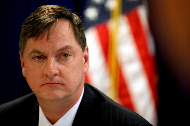 FILE PHOTO: Chicago Federal Reserve Bank President Evans takes a question during a round table with the media in Shanghai